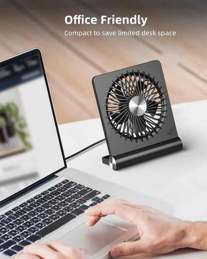 Belro ultra quiet small desk fan on a workspace, compact electronic fan for home or office use, with adjustable tilt and low noise operation.