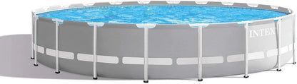 Intex Prism Frame 20ft x 52in above ground swimming pool set with frame, ladder, and pool accessories.