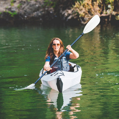 Casavibeo Oru Inlet fold-up single kayak on water, showing compact design and portable features for easy kayaking adventures.