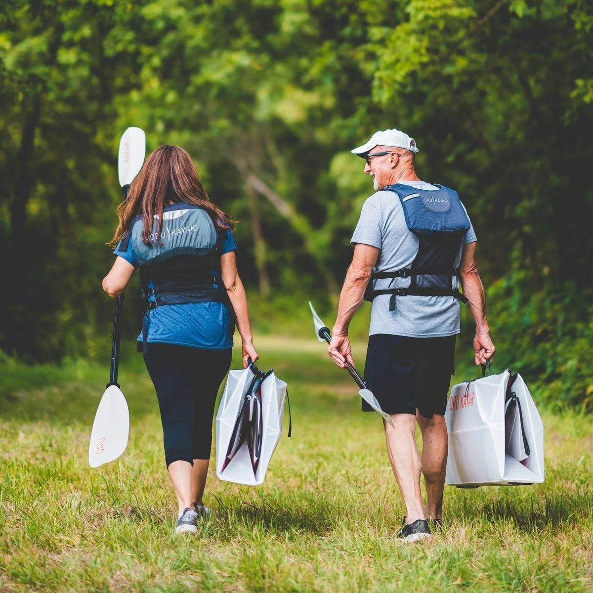 Casavibeo Oru Inlet fold-up single kayak on water, showcasing compact design and portability for outdoor kayaking adventures.
