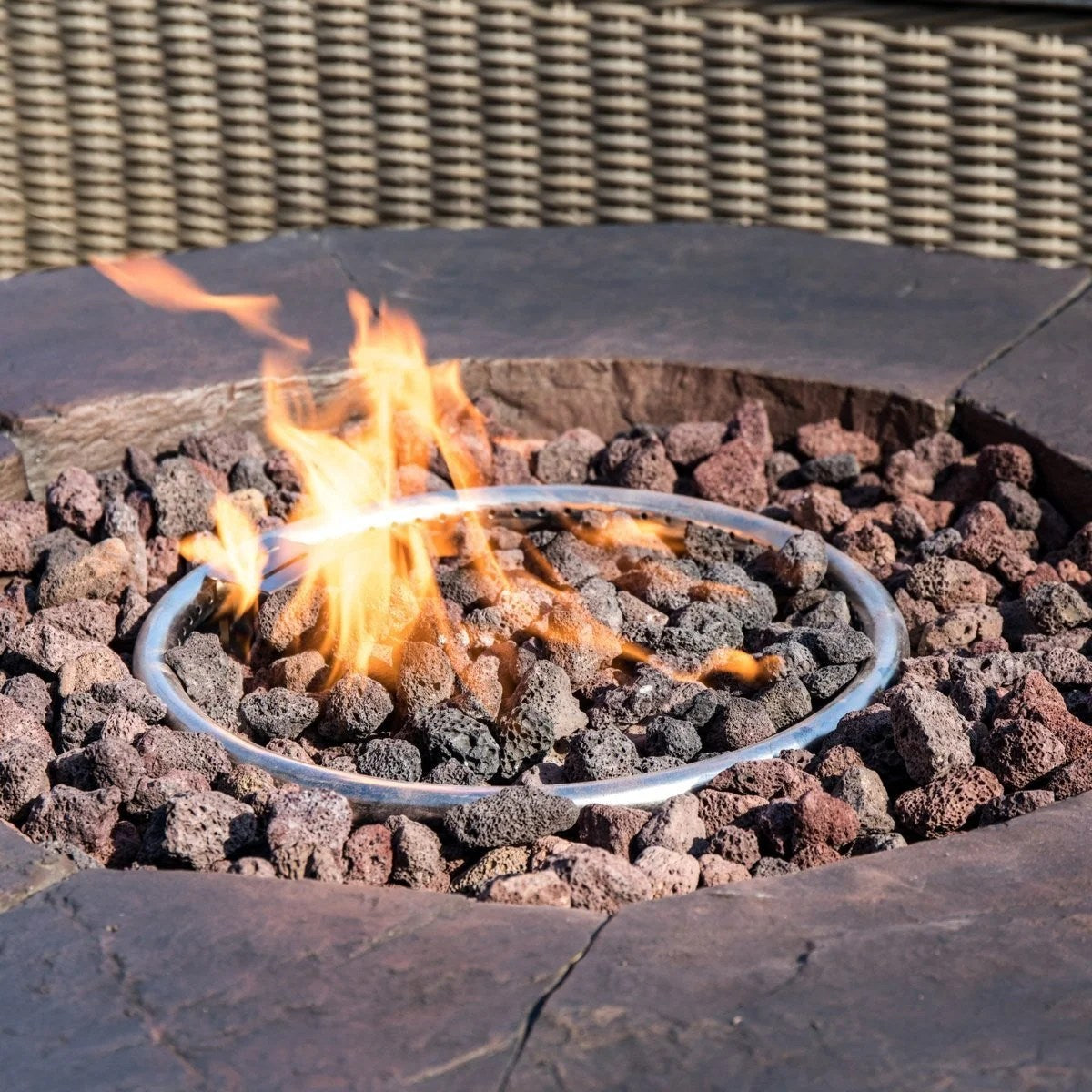 Red Barrel Studio Kimily propane outdoor fire pit with black metal frame and fire bowl, perfect for patio ambiance and outdoor gatherings.