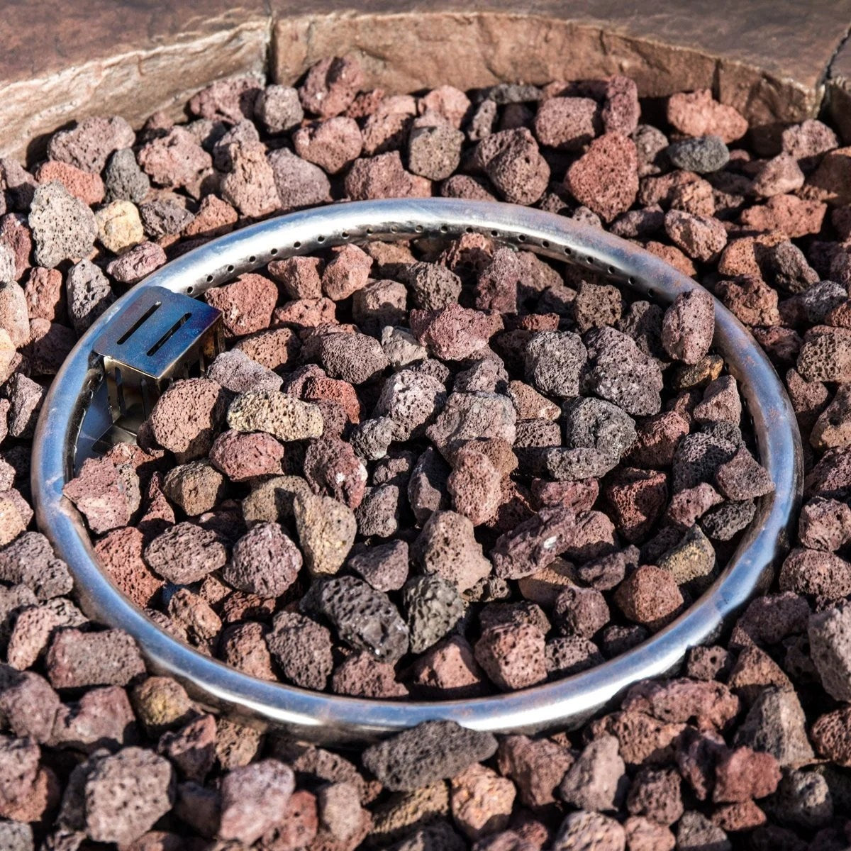 Red Barrel Studio Kimily propane outdoor fire pit with a round metal bowl and decorative base, perfect for outdoor gatherings.