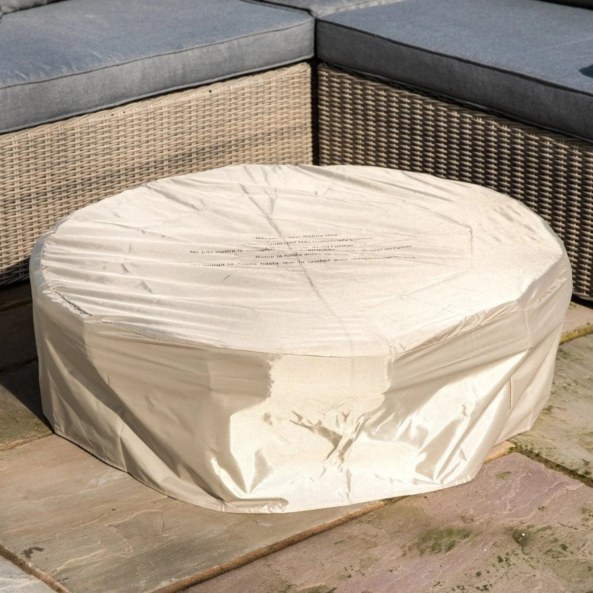 Red Barrel Studio Kimily propane outdoor fire pit by Casavibeo with a round metal design and a lit flame on a patio.