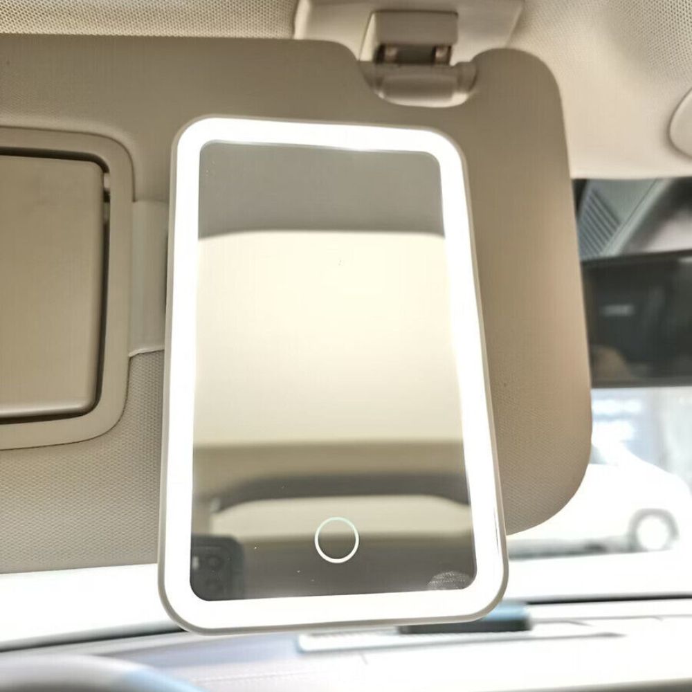 Belro LED car vanity mirror attachment mounted on a vehicle mirror, illuminated for easy makeup or grooming on the go.