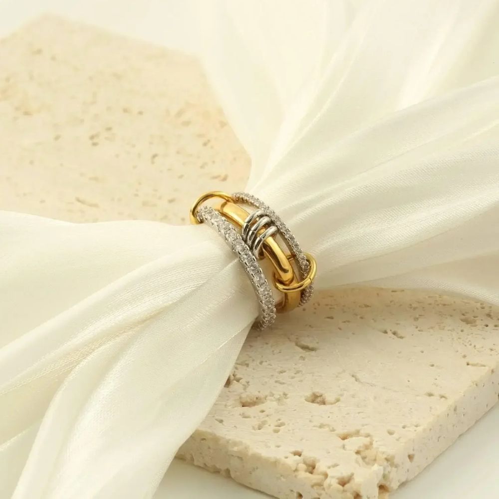 Set of seven trendy gold stackable rings by Belro, featuring sleek and modern jewelry accessories for stylish everyday wear.