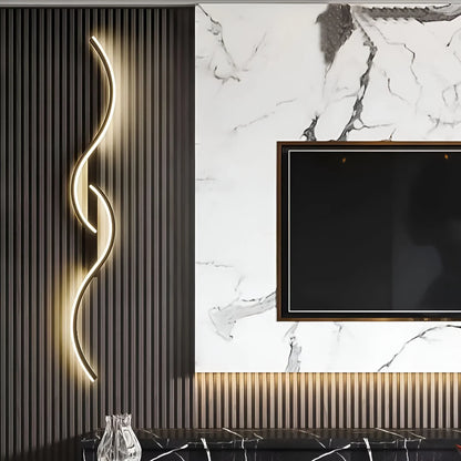Modern BowLift curved LED wall light mounted indoors, providing ambient lighting with a sleek, contemporary design.
