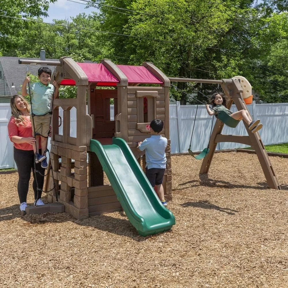 Casavibeo Step2 Naturally Playful Adventure Lodge play center with slides, climbing areas, and outdoor play features for kids.