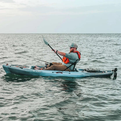 Casavibeo Vibe Kayaks Sea Ghost 110 kayak on water with paddle, showcasing sleek design and vibrant color for outdoor boating.