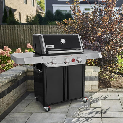 Casavibeo Weber Genesis E-325s gas grill with four burners, stainless steel lid, side shelves, and control knobs for outdoor cooking