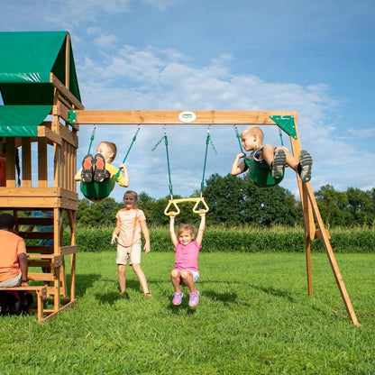 Casavibeo Backyard Discovery Belmont cedar swing set with swings, slide, and climbing features in an outdoor backyard setting.