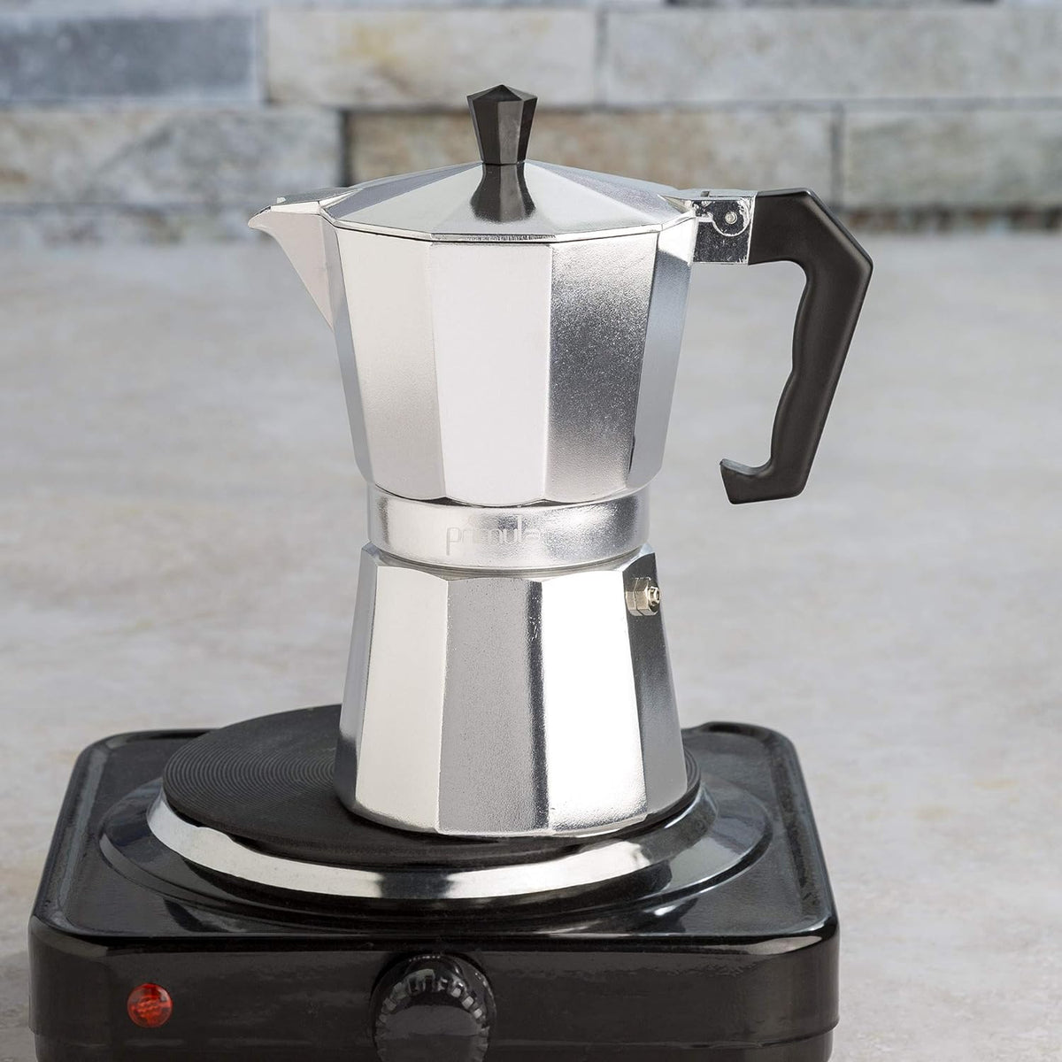 Belro classic stovetop espresso maker for Italian and Cuban coffee brewing, with a polished metal finish and black handle.