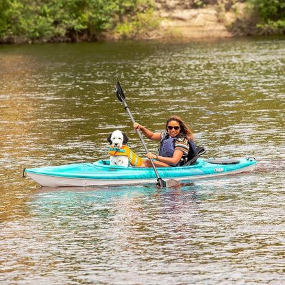 Casavibeo Pelican Argo 100XR recreational kayak on water, featuring a sit-on-top design, adjustable seat, and paddle for outdoor recreation.