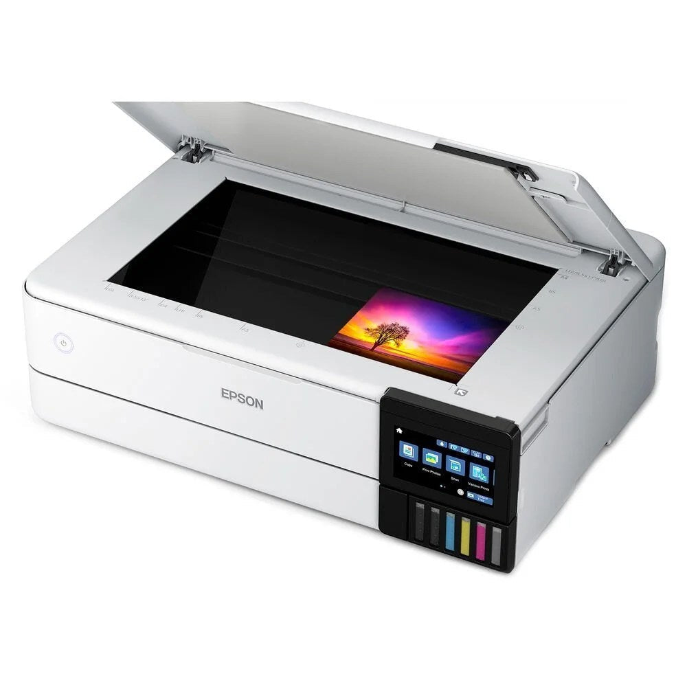 Epson EcoTank Photo ET-8550 all-in-one supertank printer with large ink tanks and control panel, shown in a home office setting.