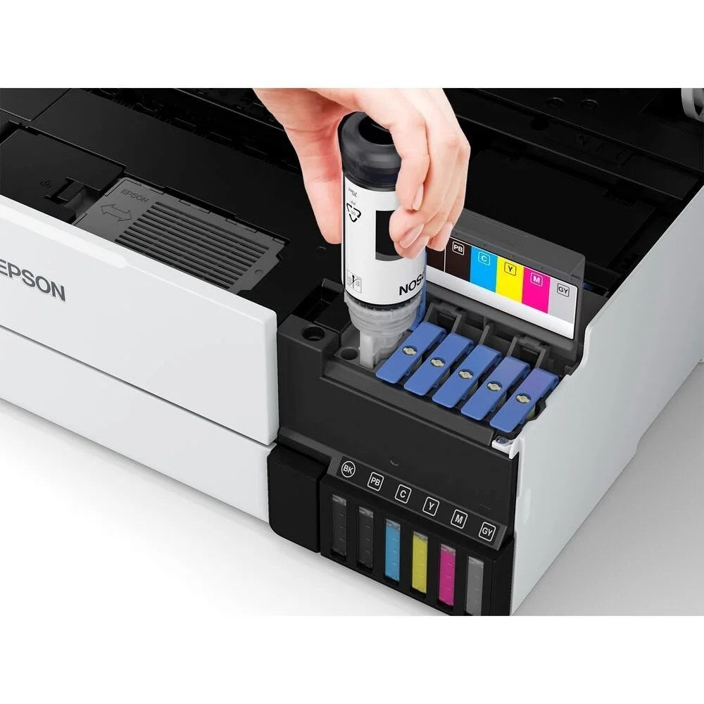 Epson EcoTank Photo ET-8550 all-in-one supertank printer with multiple paper trays and control panel, displayed on a desk.