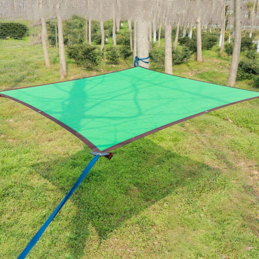 Belro outdoor mesh patio sun shade sail canopy attached to a patio, providing shade and UV protection for outdoor spaces.