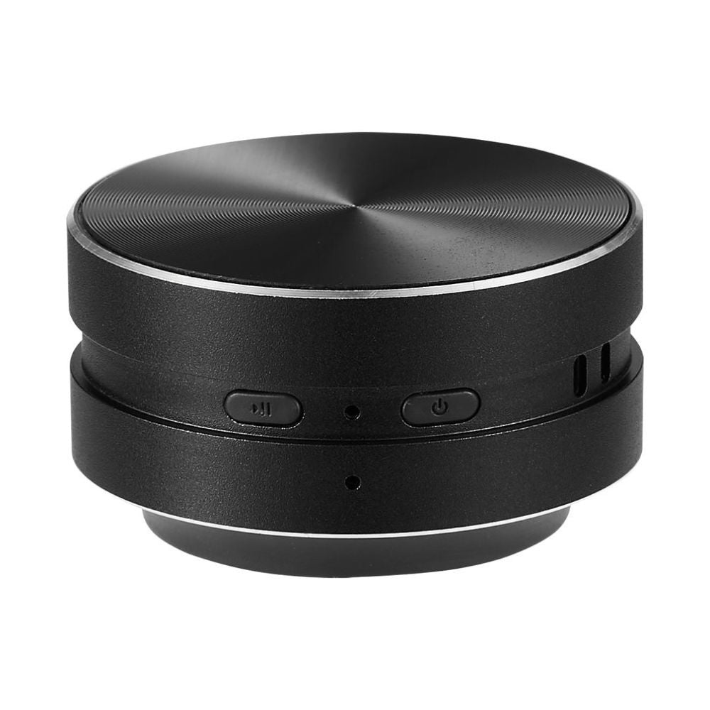 Belro Bone Induction Speaker attached to a surface, showcasing portable electronic audio device that turns surfaces into speakers.