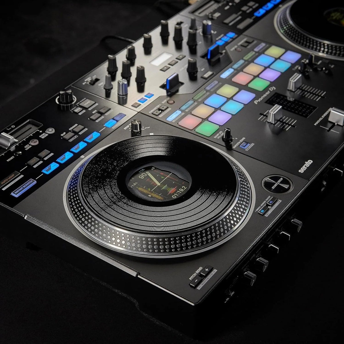 Casavibeo Pioneer DJ DDJ-REV7 DJ controller with jog wheels, mixer, and control knobs on a black surface.