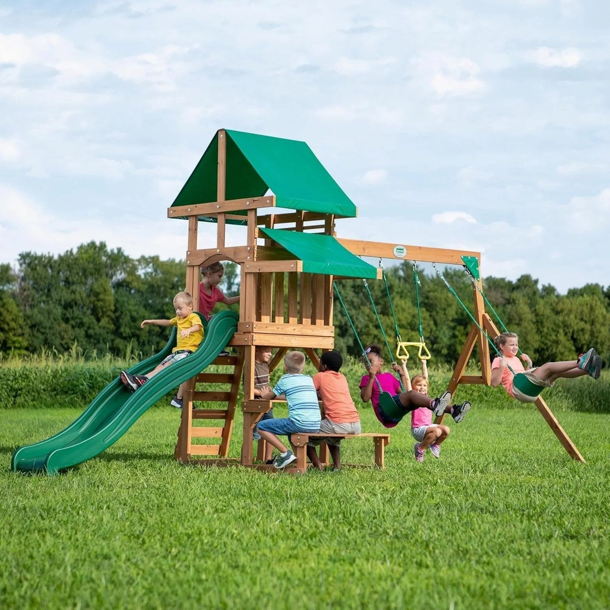 Casavibeo Backyard Discovery Belmont cedar swing set with slide, swings, and climbing ladder in a backyard setting