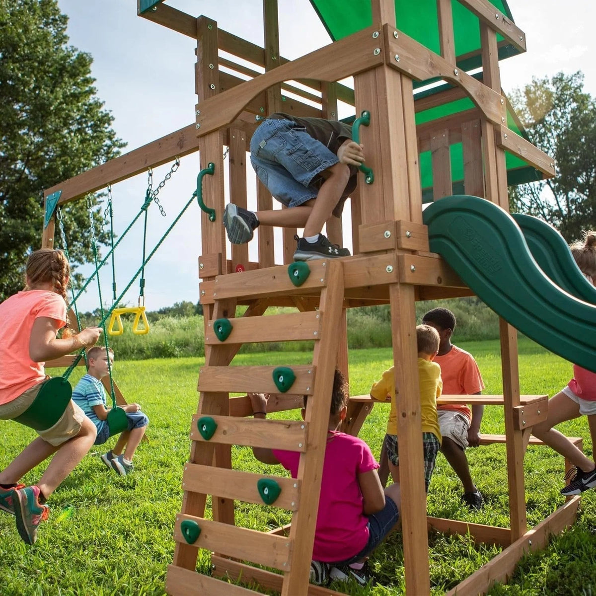 Casavibeo Backyard Discovery Belmont All Cedar Swing Set with swings, slide, and climbing features in a backyard setting.