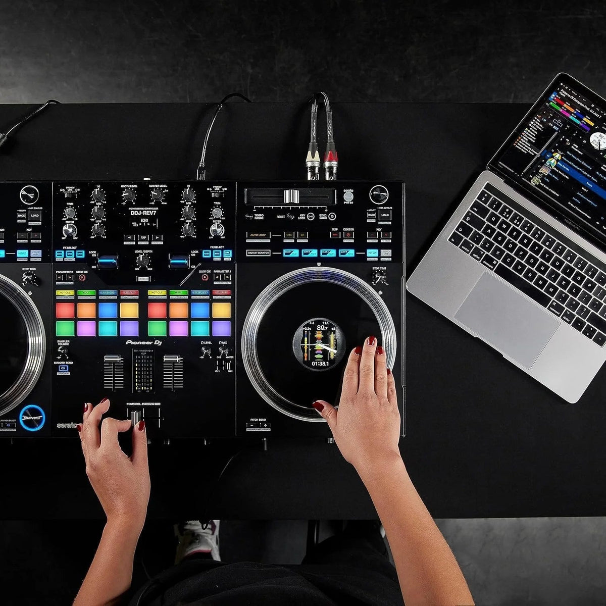 Casavibeo Pioneer DJ DDJ-REV7 DJ Controller with jog wheels, mixer controls, and colorful LED lights for professional DJ setup
