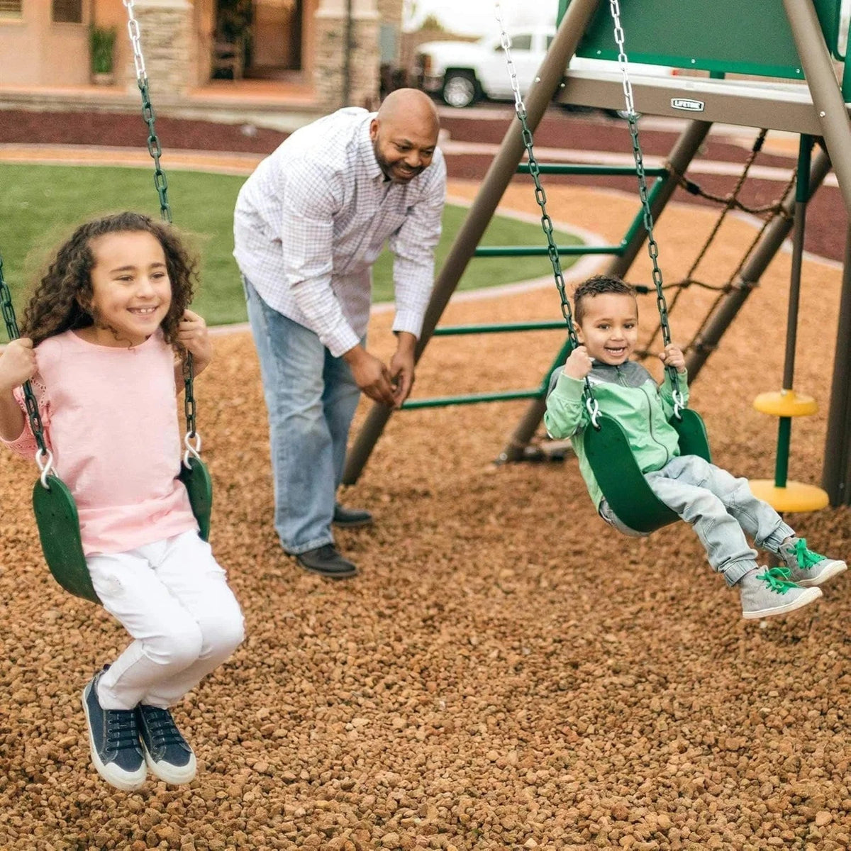 Casavibeo Lifetime Big Stuff Swing Set with multiple swings and a slide, set up in a backyard playground.