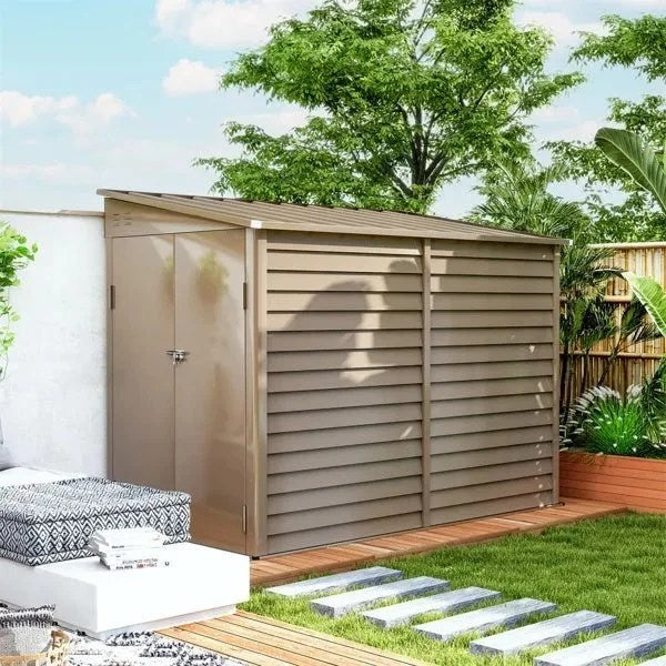 Casavibeo garden shed with white doors and window, set in a lush outdoor garden area.