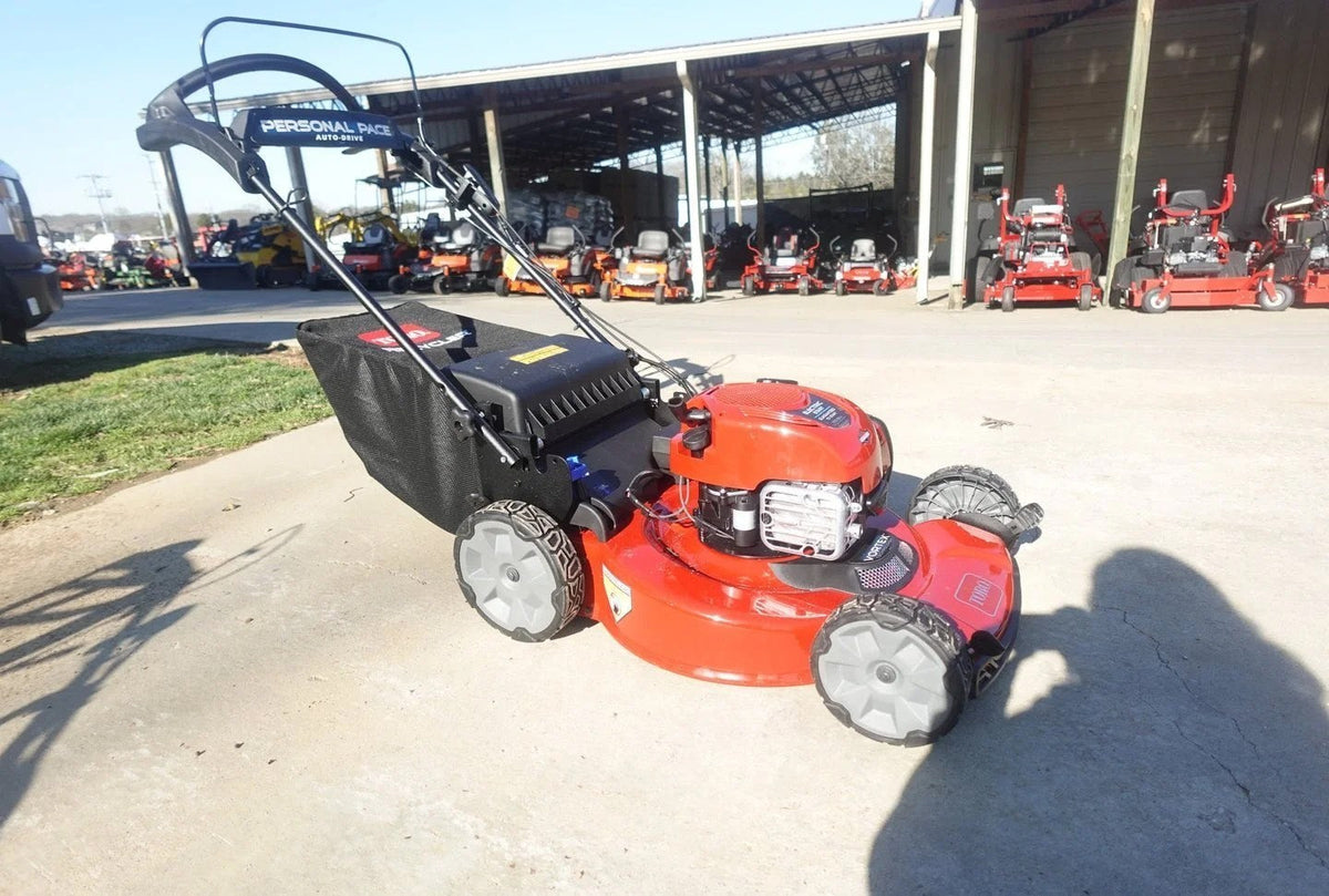 Casavibeo Toro 22-inch Recycler SmartStow electric lawn mower with cutting deck and grass collection bag in a yard setting.