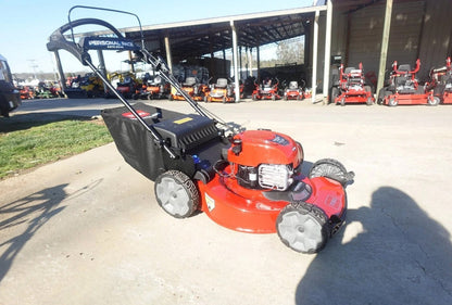 Casavibeo Toro 22-inch Recycler SmartStow electric lawn mower with cutting deck and grass collection bag in a yard setting.