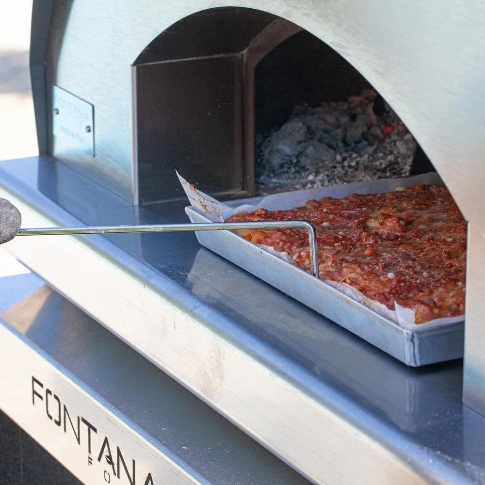 Casavibeo Fontana Forni Mangiafuoco wood-fired pizza oven in anthracite with stone exterior and large opening for authentic pizza baking.