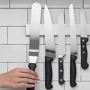 Belro 14-inch magnetic knife and tools holder mounted on kitchen wall, organizing cutlery and kitchen tools efficiently.