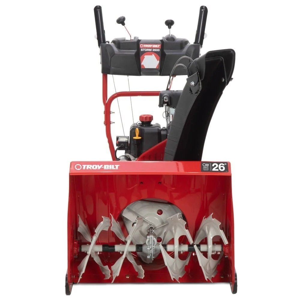 Casavibeo Troy-Bilt Storm 2600 26-inch two-stage gas snow blower with electric start, showing the snow clearing auger and controls