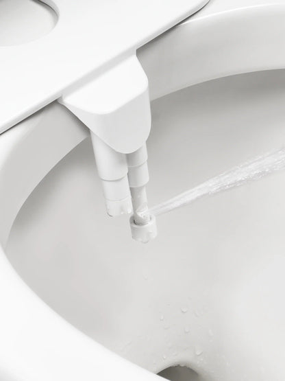 Belro toilet bidet attachment installed on bathroom toilet, showcasing water control nozzle and adjustable features.