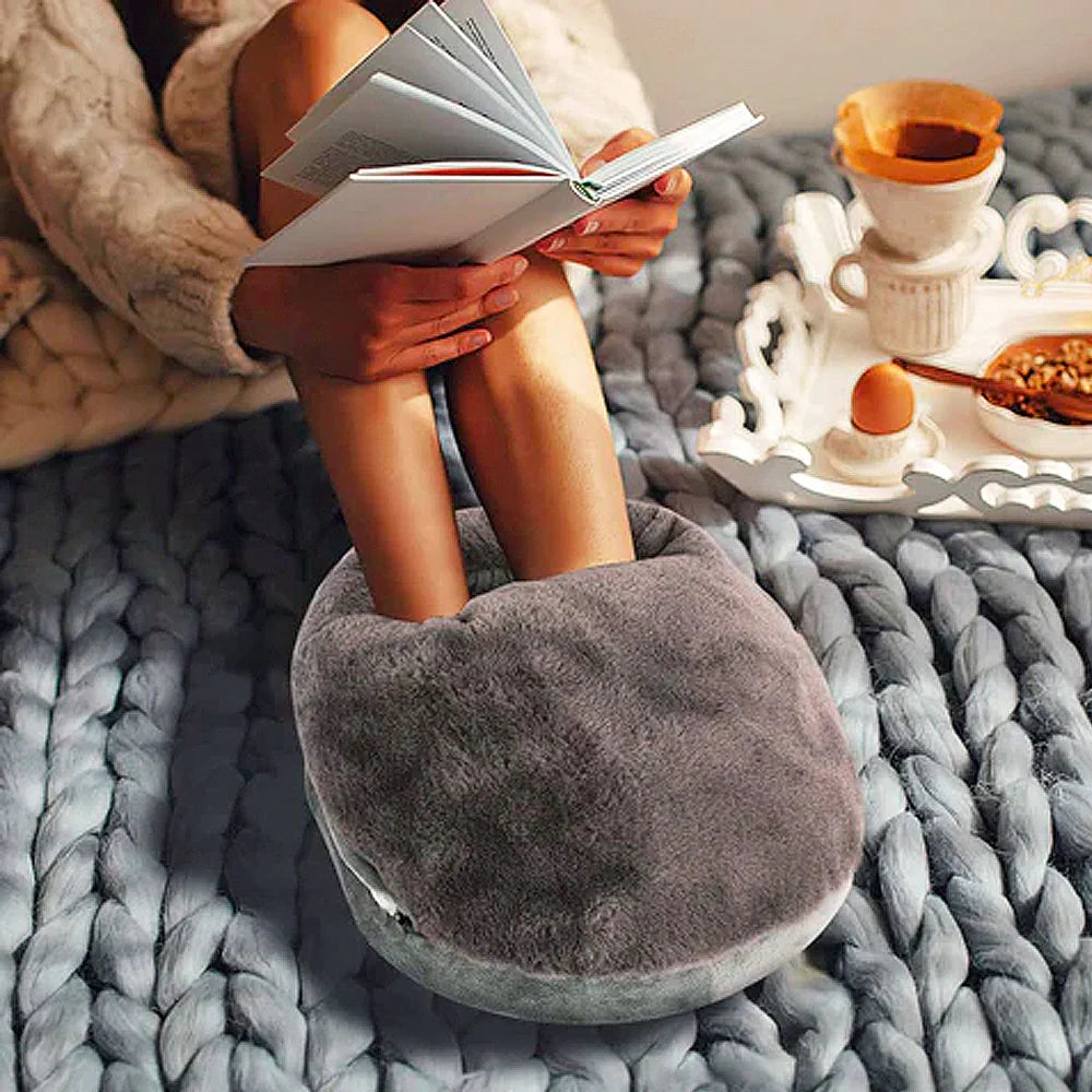Belro Electric XL foot warmer resting on a wooden surface, designed for pain relief and comfort in health and beauty.