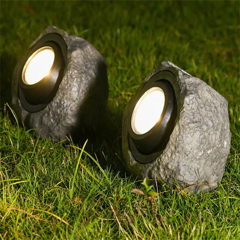 Belro Stonelight pathway outdoor lighting illuminating a garden pathway with warm glow in a home and garden setting.