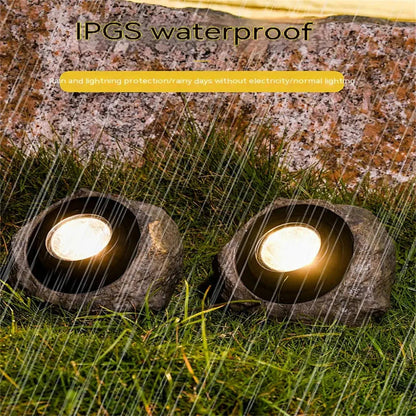 Belro Stonelight pathway lighting in outdoor garden setting, showcasing durable stone design for garden illumination.