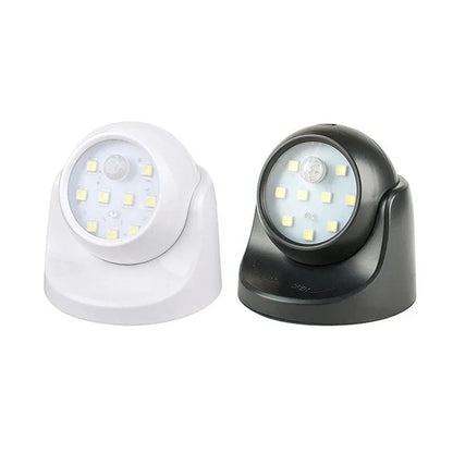Belro wireless LED spotlight with motion detector, 360° rotatable outdoor light in a garden setting, energy-saving design.