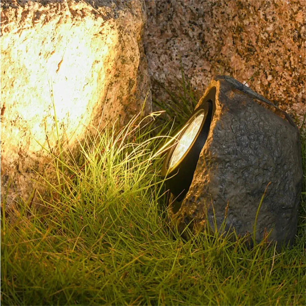 Belro Stonelight pathway lighting fixture for outdoor garden paths, featuring a sleek stone design and warm illumination.