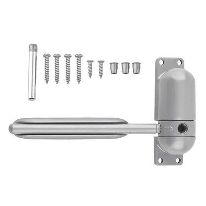Belro automatic door closing mechanism installed on a door, showcasing tools and hardware for smooth, automated door operation.