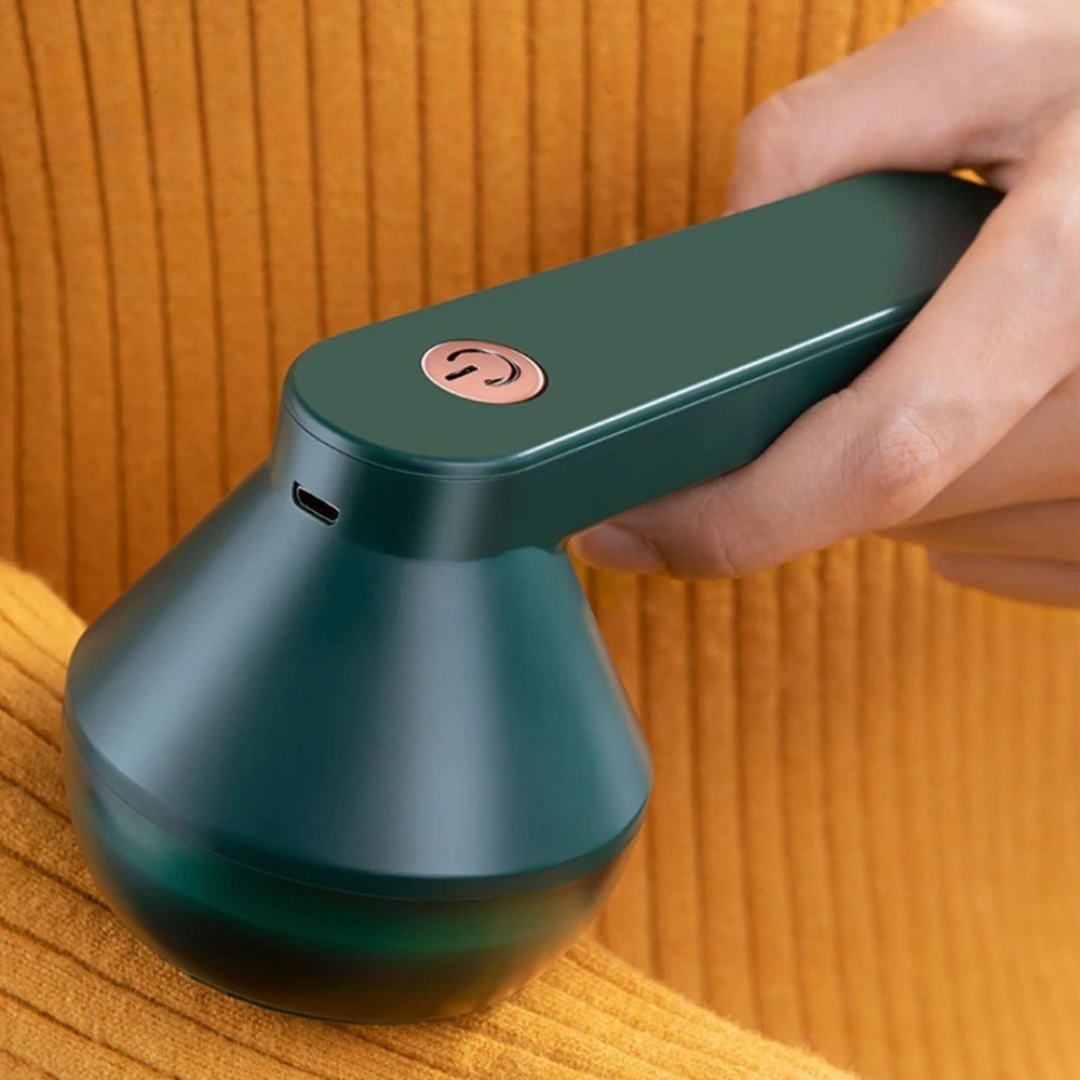 Belro electric lint remover for home and outdoor use, compact device with a safety guard for removing lint from clothing and fabrics.