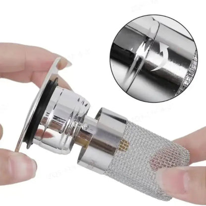 Stainless steel drain strainer with pop-up function by Mivoza, designed to prevent blockages in bathroom sink or shower drain.