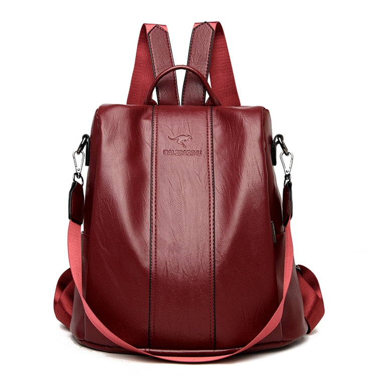 Red leather anti-theft backpack for women by BowLift, vintage-style travel bag with secure compartments and sleek design.