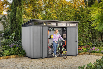 Grey Keter Cortina 9x7 ft. outdoor storage shed with double doors, heavy-duty floor, designed for garden storage by Casavibeo