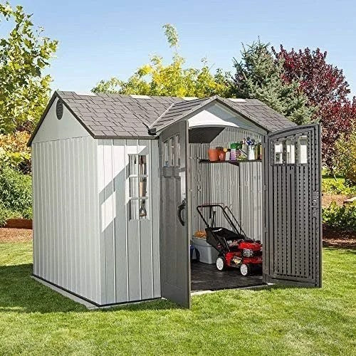 Casavibeo Lifetime 60243 10x8 ft. outdoor storage shed with double doors and sloped roof, set in a backyard.