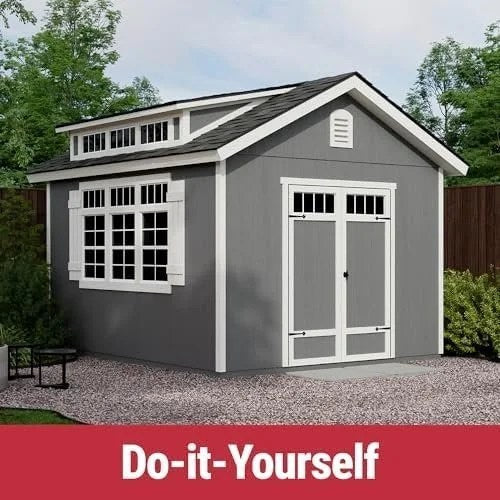 Beige Windemere 10x12 wooden storage shed by Casavibeo with floor, DIY assembly, shown outdoors with a clear sky.