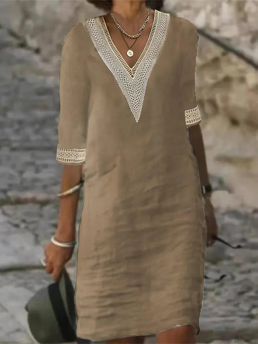 Elegant Belro half-sleeve dress with a fitted waist and stylish neckline, displayed on a hanger against a neutral background.