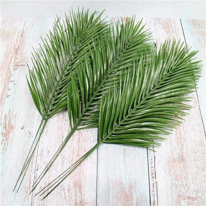 Set of 12 artificial palm leaves from Belro, ideal for home and garden decor, featuring lush green tropical foliage.