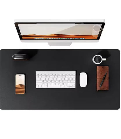 Black leather desk mat from Belro, ideal for home office desks, providing a smooth surface for writing and keyboard use.
