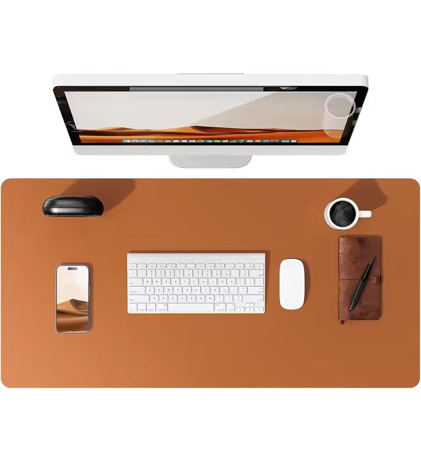 Brown leather desk mat by Belro, durable and stylish for home office desks, providing a smooth surface for writing and computer use.
