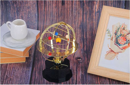 Handcrafted brass orrery solar system model by BowLift showing five planets with intricate mechanical details.