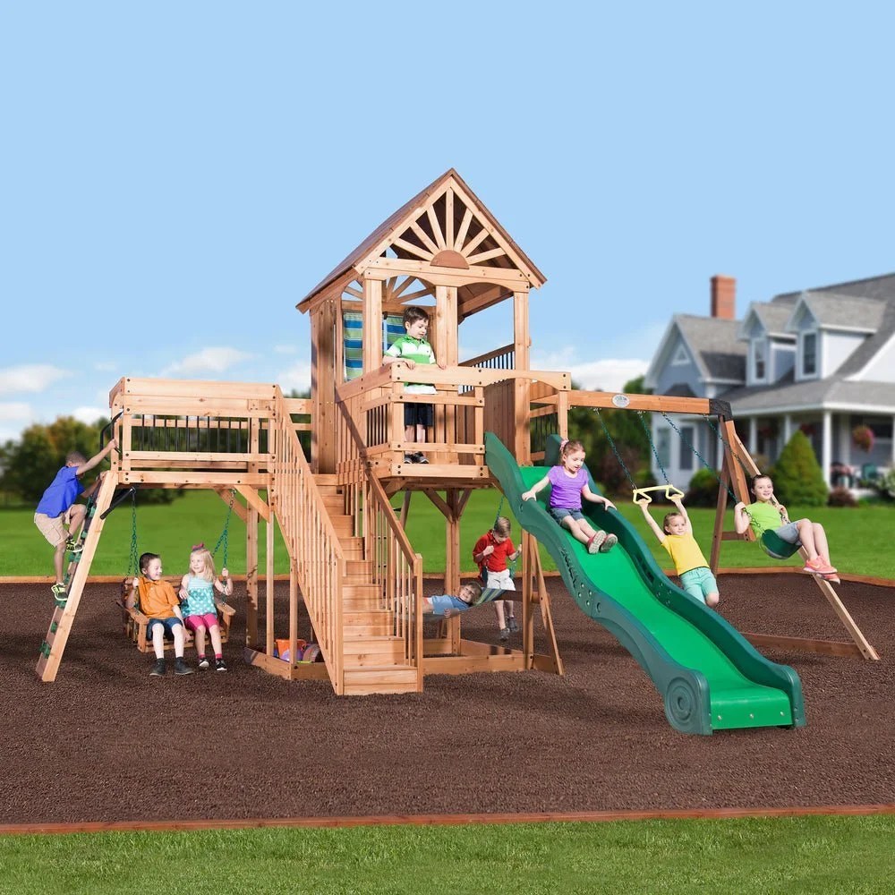 Casavibeo Backyard Discovery Caribbean Swing Set with slides, swings, and climbing features in a backyard play area.